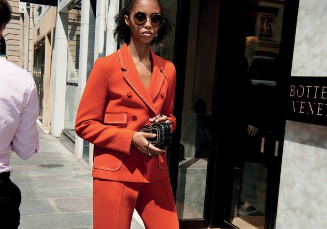 clothing apparel person suit overcoat coat female sunglasses accessories woman