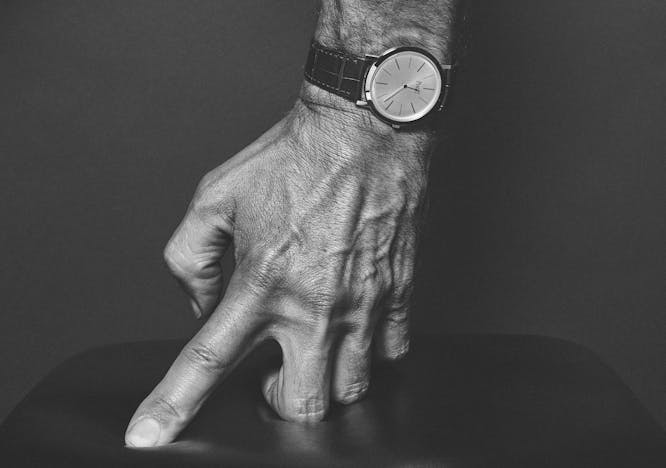 finger wristwatch person human