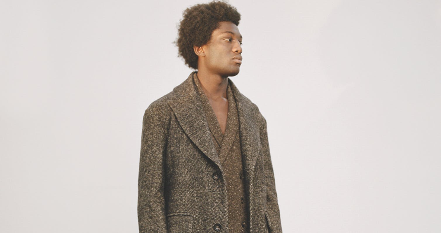 clothing apparel person human overcoat coat hair