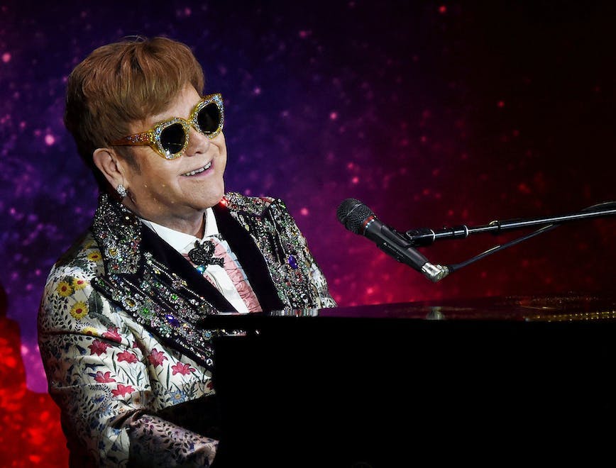 microphone electrical device sunglasses musician person musical instrument leisure activities performer piano pianist