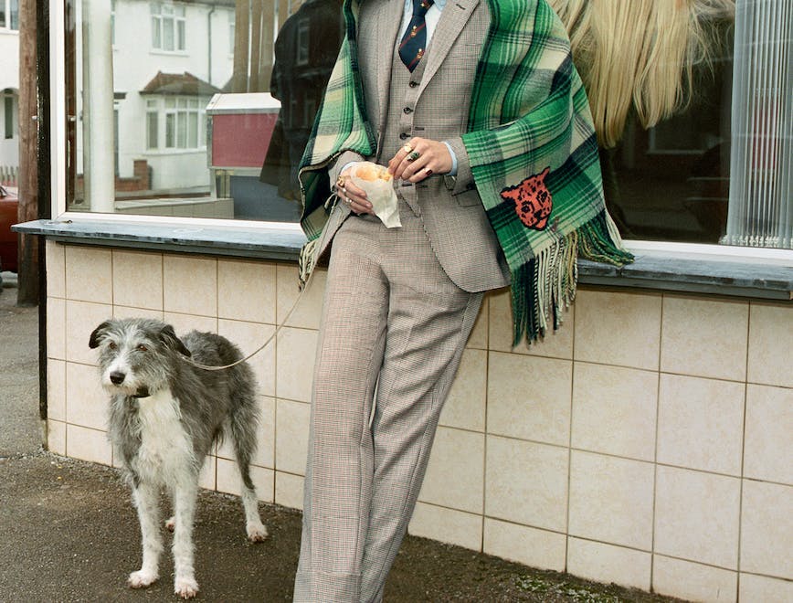 clothing shoe footwear dog person overcoat coat suit pants home decor