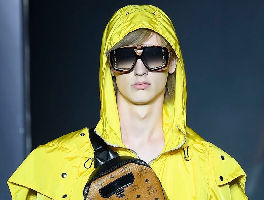 clothing apparel coat raincoat person human sunglasses accessories accessory