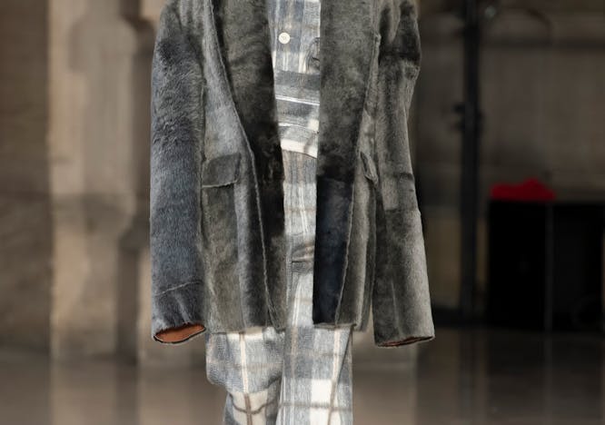 clothing apparel coat overcoat sleeve person human