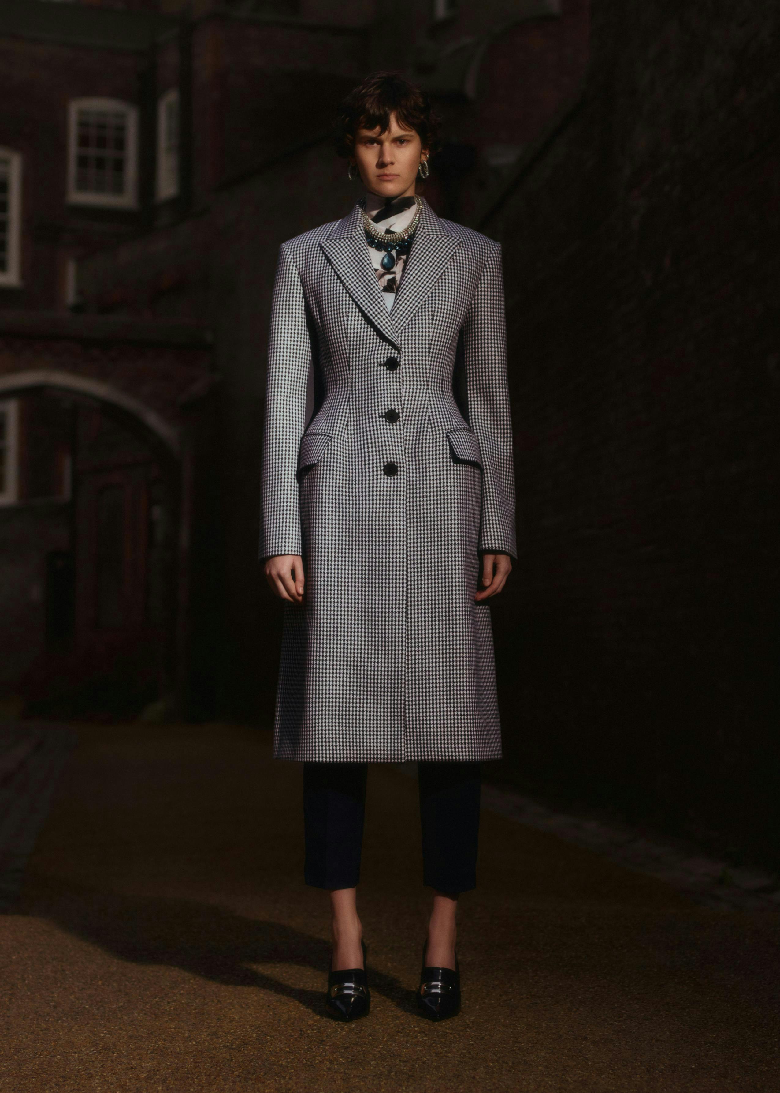 clothing apparel overcoat coat person human sleeve