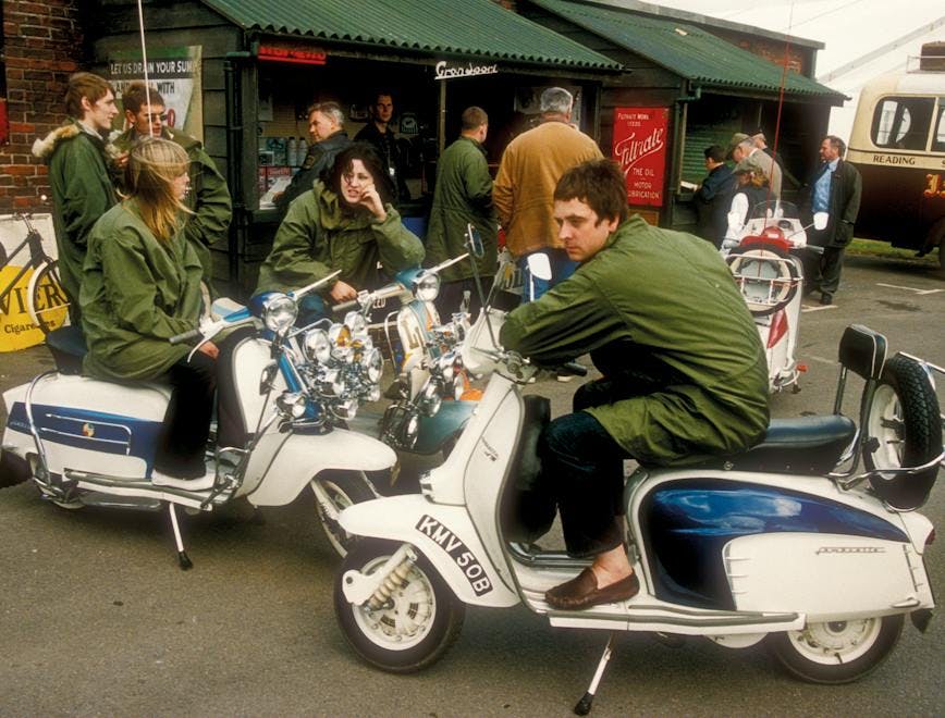 uk united kingdom great britain england 2000s adults white male female men women girls mods clothing parkas woman guys clothes 60s caucasian sixties scooters scooterists goodwood revival person wheel machine motorcycle vehicle transportation motor scooter bicycle bus moped