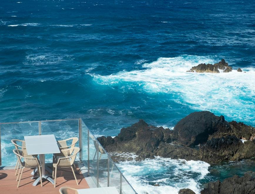 chair furniture promontory sea ocean outdoors water nature sea waves