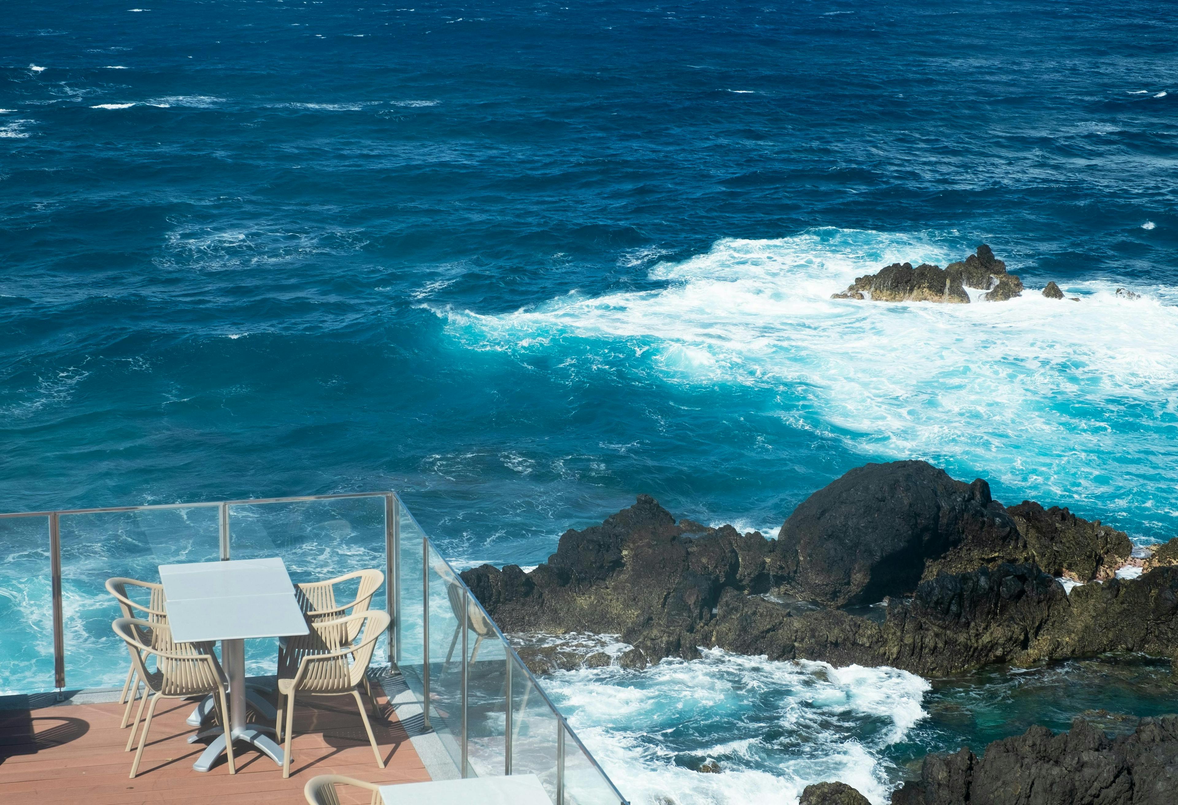 chair furniture promontory sea ocean outdoors water nature sea waves