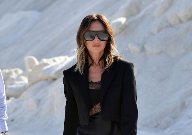 clothing female person suit overcoat coat woman sunglasses accessories blazer