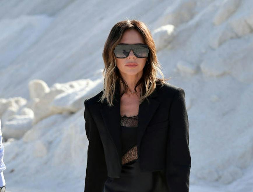 clothing female person suit overcoat coat woman sunglasses accessories blazer
