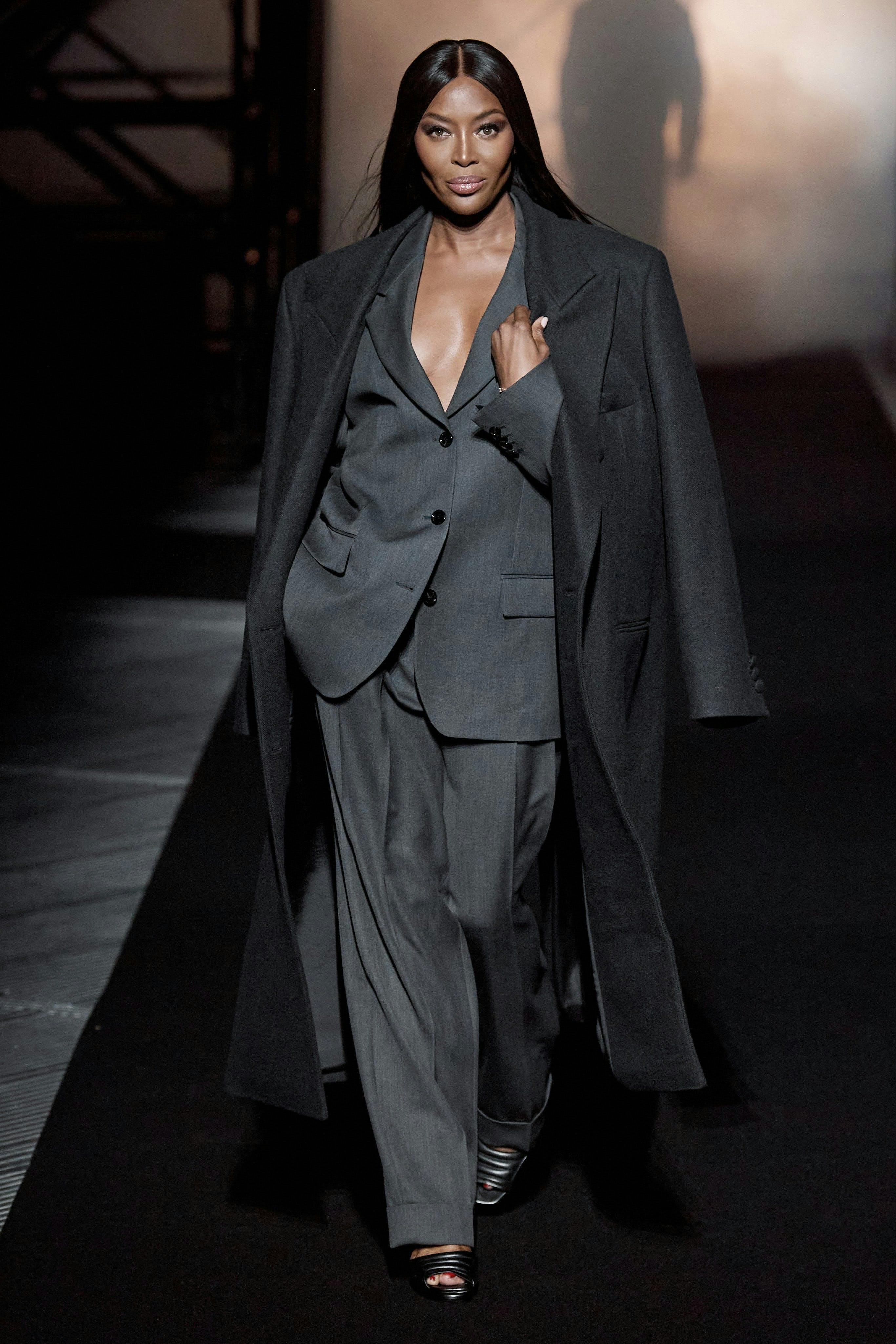 clothing apparel suit overcoat coat tuxedo female person dress woman