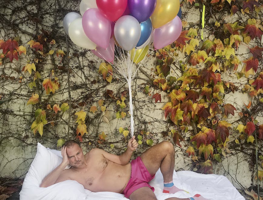 Juergen Teller Self-Portrait with pink shorts and balloons Paris 2017 © Juergen Teller, All rights Reserved