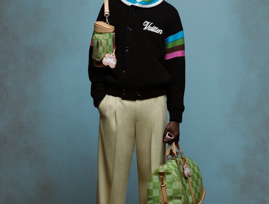 accessories bag handbag purse person standing long sleeve sleeve pants sweater