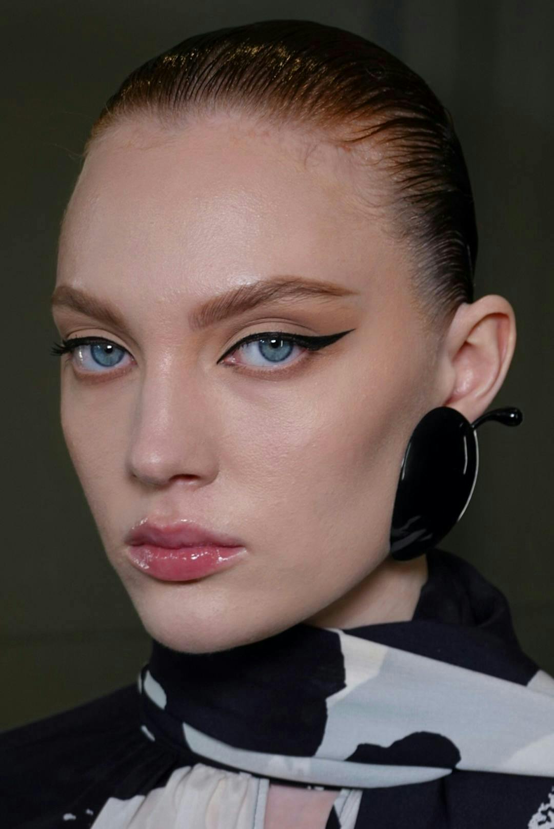 adult female person woman earring lipstick face head portrait skin