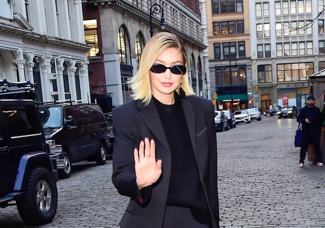 new york formal wear suit shoe blazer coat pedestrian person wheel lady path
